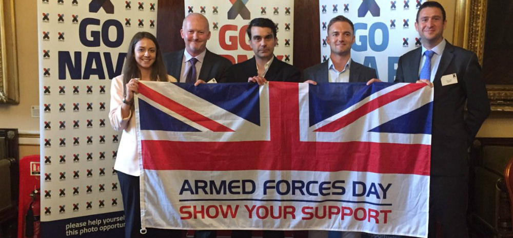 Supporters holding up Armed Forces Day flag